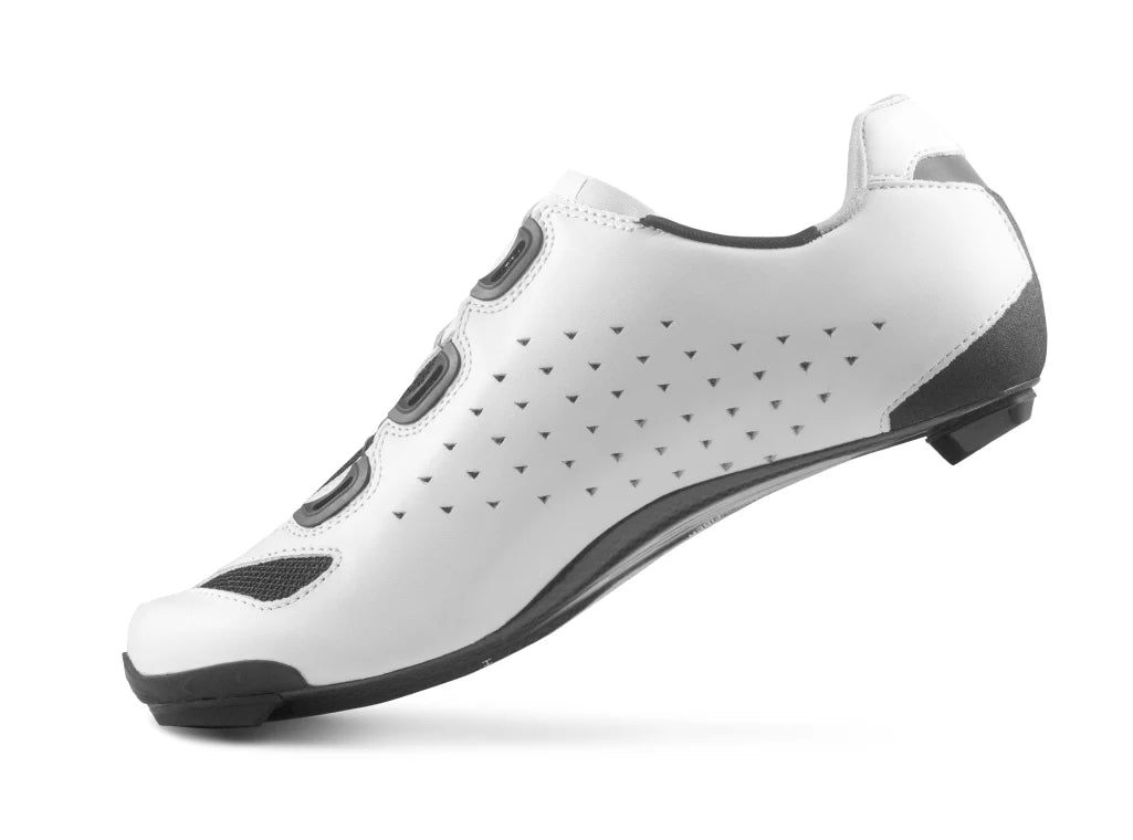 White cycling shoe with black accents on a white background