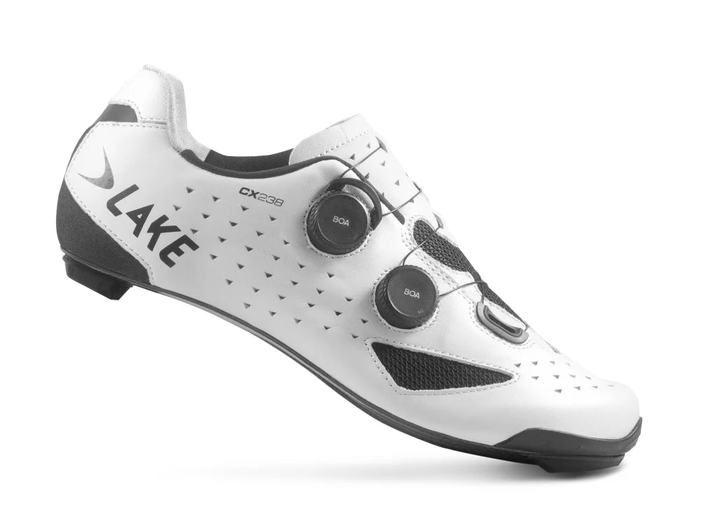 White cycling shoe with black accents on a white background