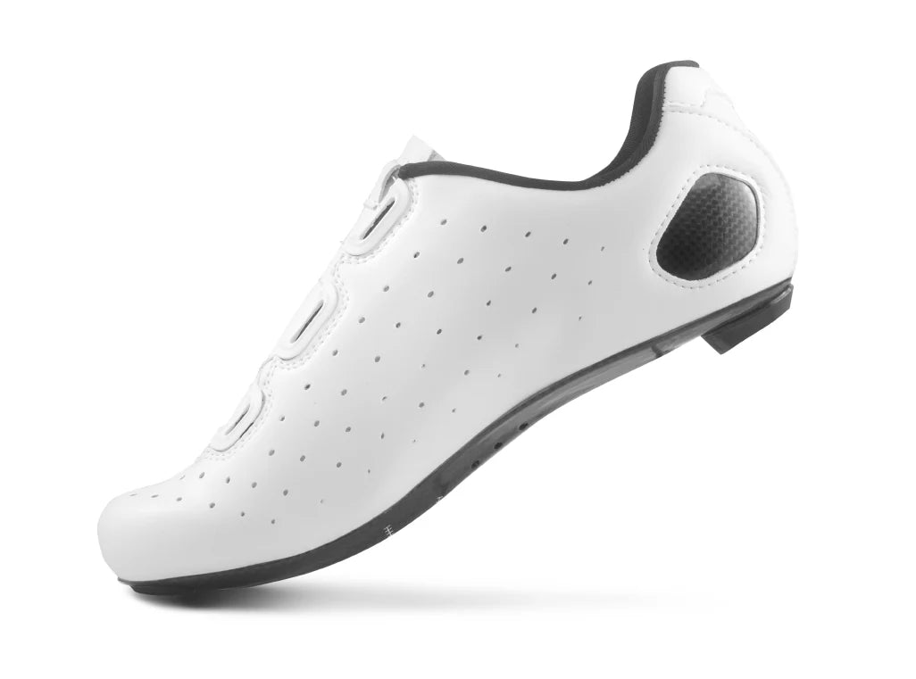 White cycling shoe with black sole on a white background