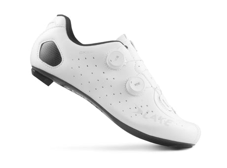 White cycling shoe with black soles on a white background