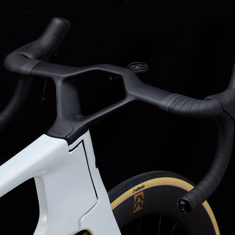 Detail of white Cervélo S5 Dura-Ace Di2 Road Bike cockpit with aero handlebars and internal routing, built for aerodynamic road racing performance.