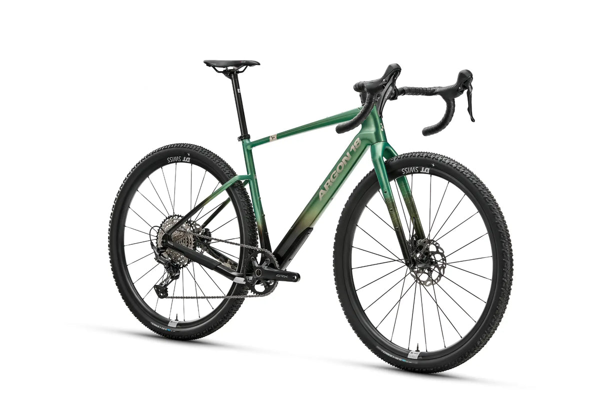 Three-quarter rear view of green Argon 18 Dark Matter GRX RX822 (1x) Gravel Bike, highlighting its geometry and Shimano GRX components.