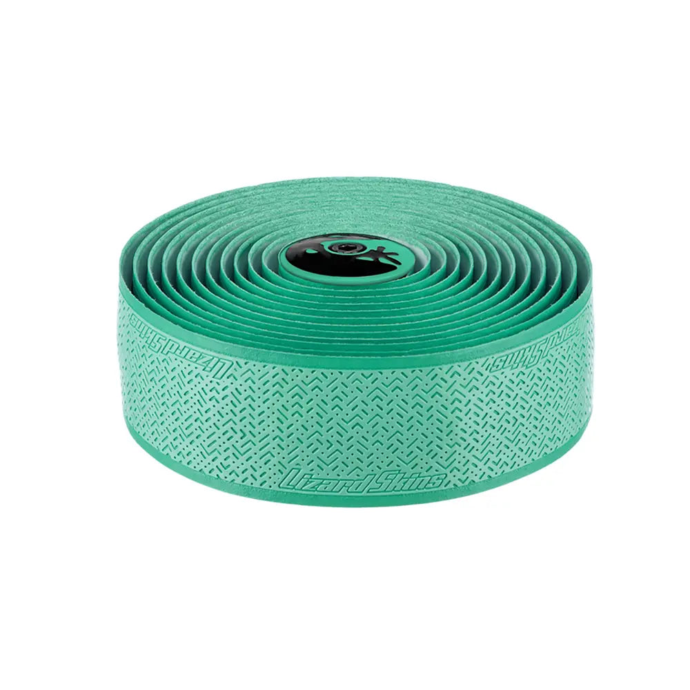A roll of Lizard Skins DSP V2 2.5mm Bar Tape in teal, designed for bicycle handlebars, offers a durable and textured pattern to ensure superior grip. The tape is coiled neatly with the Lizard Skins logo prominently displayed.