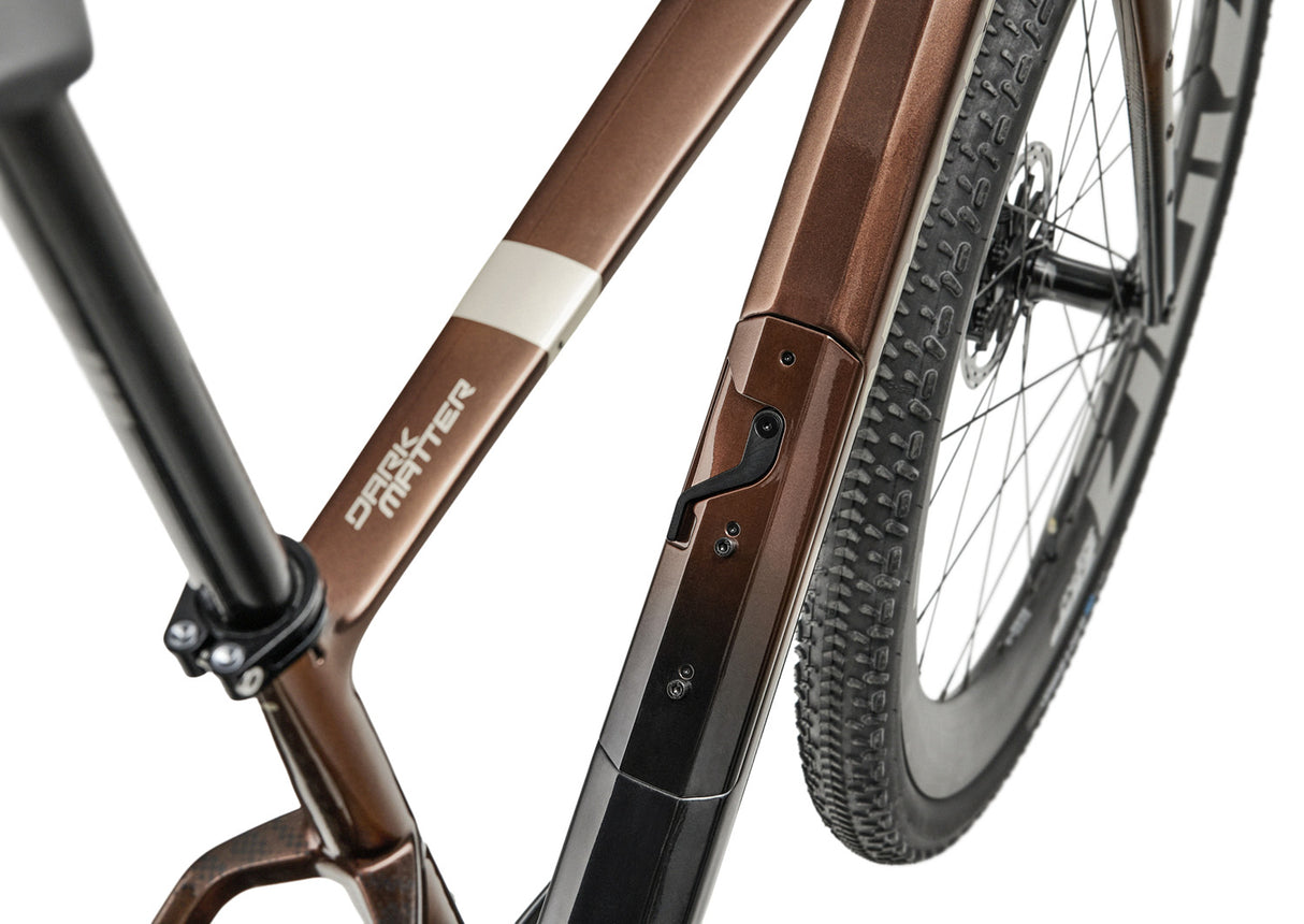 Close-up of Argon 18 Dark Matter Force XPLR AXS Gravel Bike's downtube storage and frame detailing for utility and style.