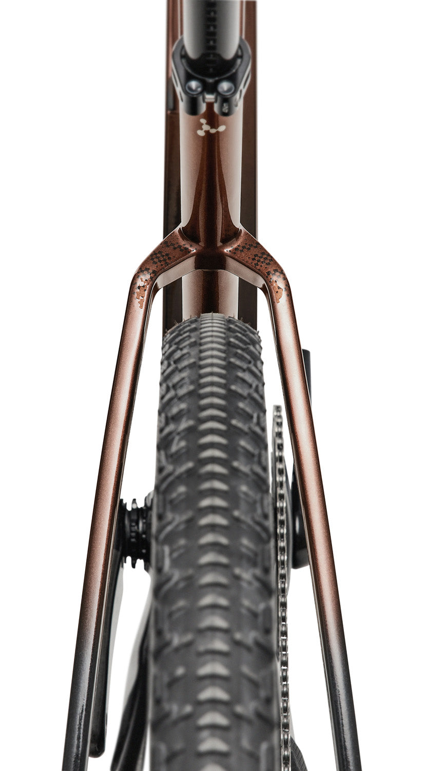 Rear tire clearance and seat stay design of Argon 18 Dark Matter Force XPLR AXS Gravel Bike for rugged gravel performance.