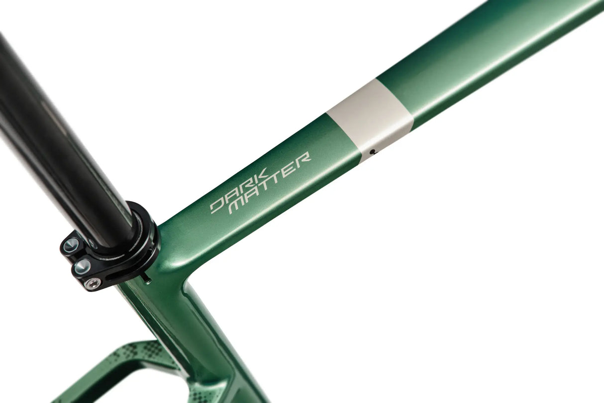 Top tube detail of Argon 18 Dark Matter GRX RX822 (1x) Gravel Bike in green, featuring the 'Dark Matter' branding and sleek frame finish.