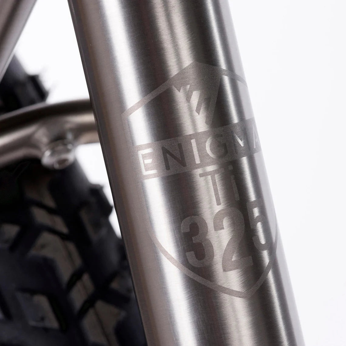 Close-up of Enigma Escape titanium frame logo