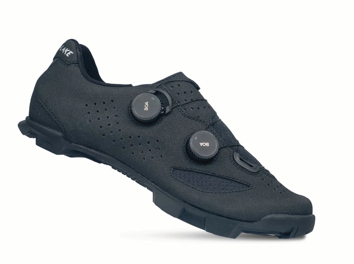 Black cycling shoe with velcro straps on a white background