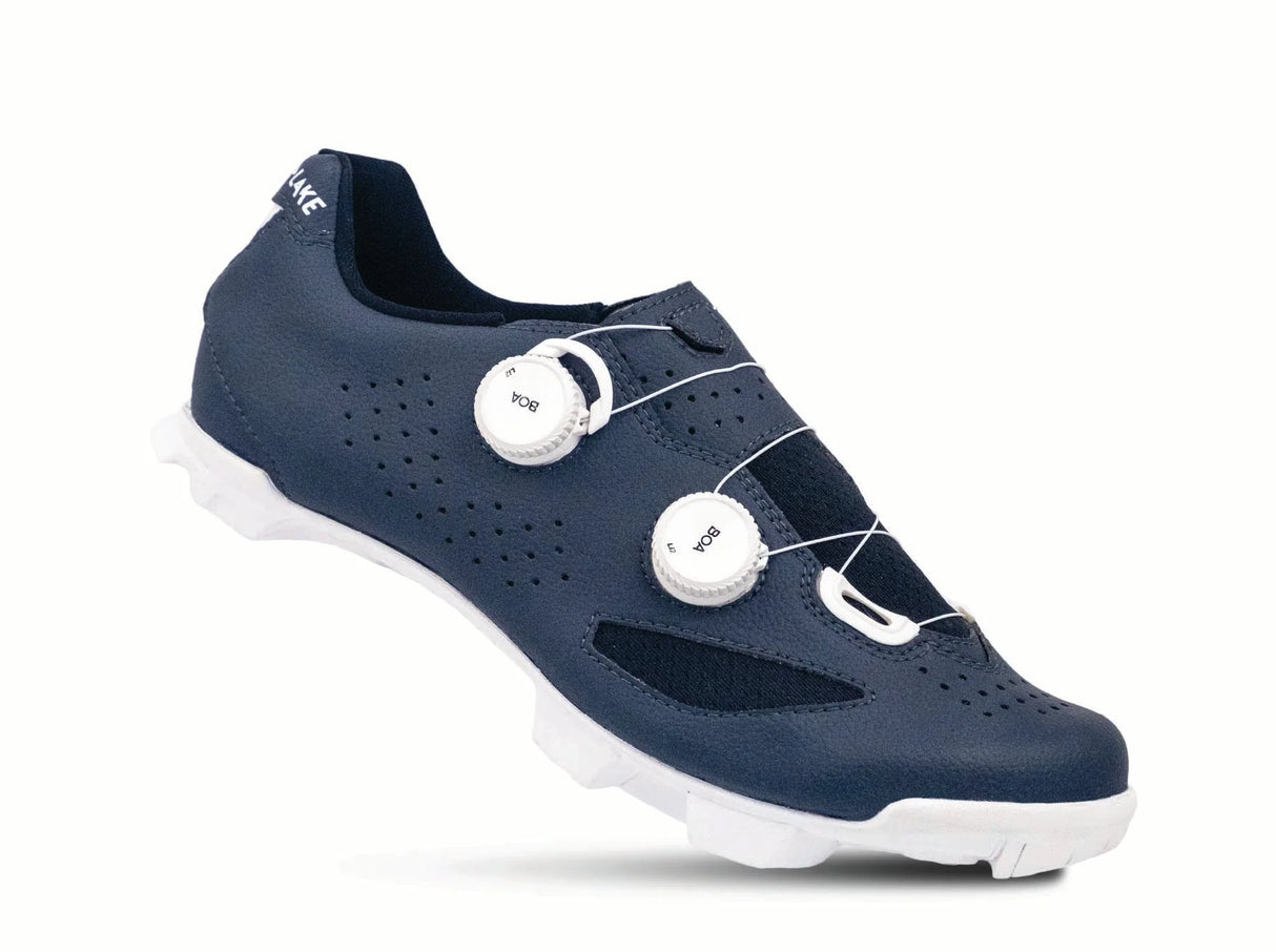 Navy cycling shoe with white sole on a white background