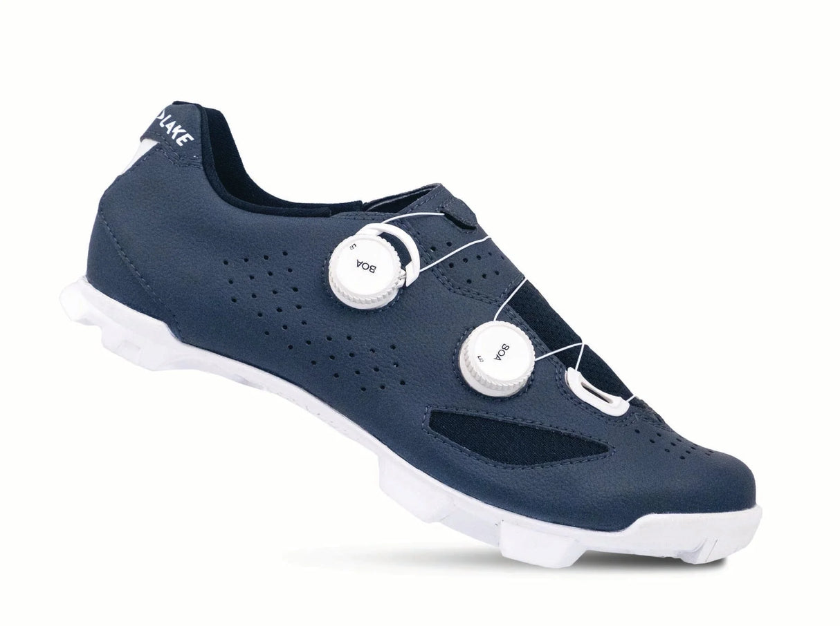 Navy cycling shoe with white sole on a white background