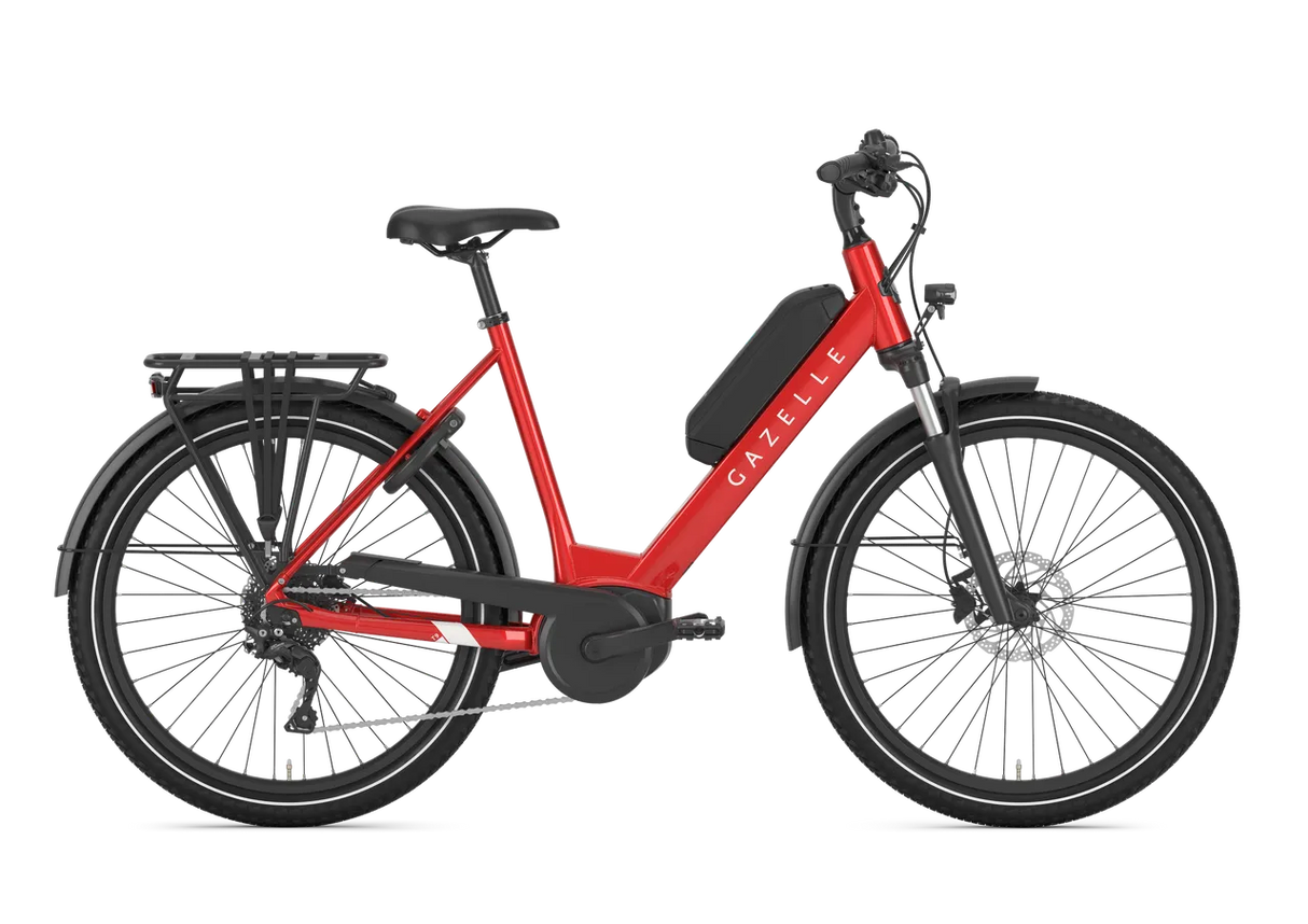 Gazelle Medeo T9 HMB Low Step Hybrid E-Bike in vibrant red, designed for effortless urban mobility and outdoor recreation cycling.