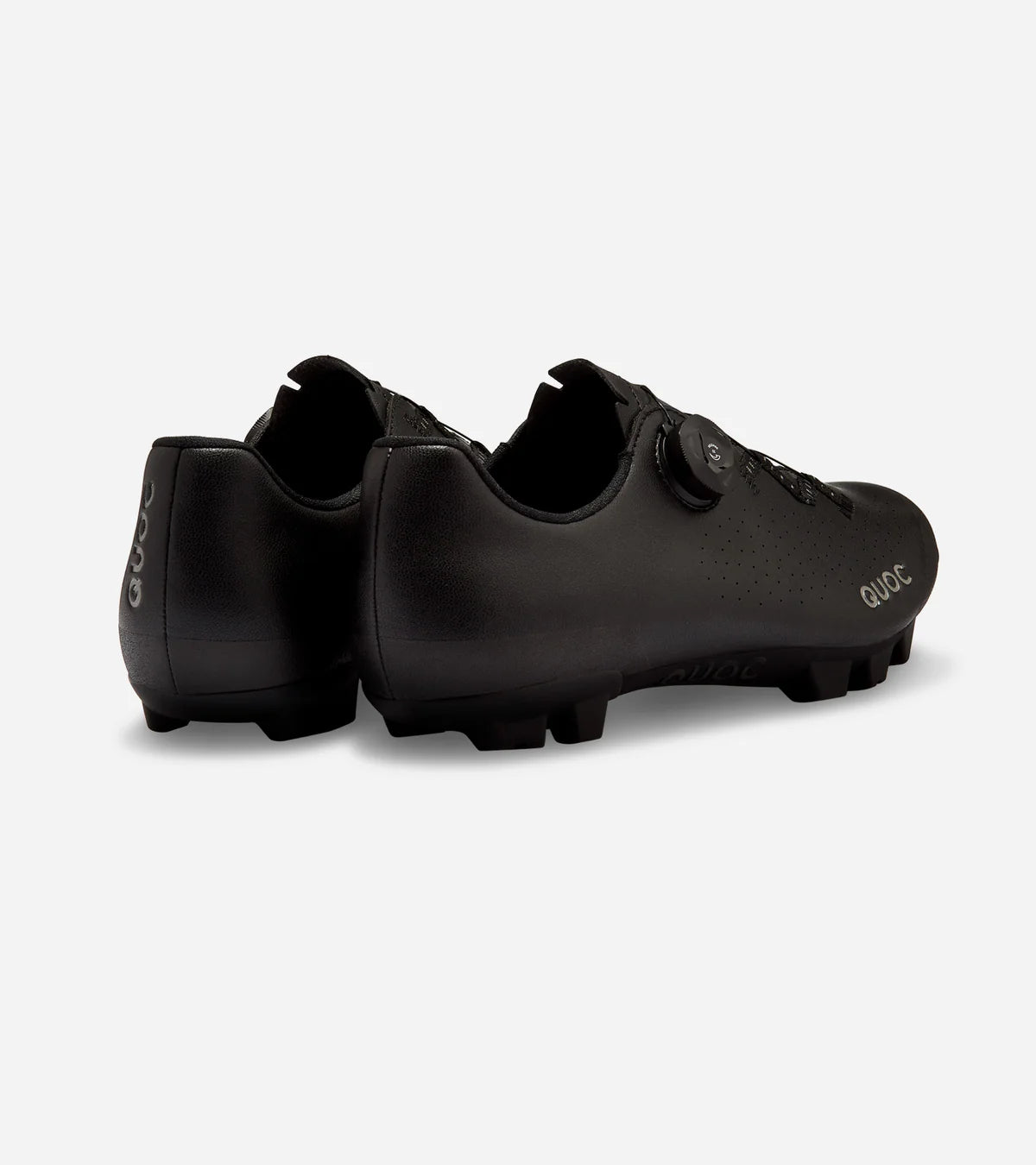 Rear angle of QUOC Escape Off-Road Shoe in black, emphasizing heel support and rugged outsole for off-road cycling.