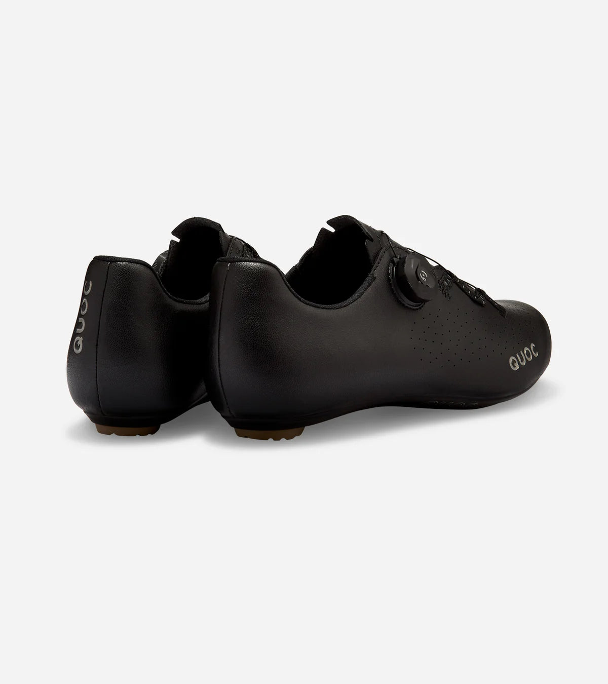 Rear view of black QUOC Escape Road Shoes showing heel support and reflective branding for visibility and safety.
