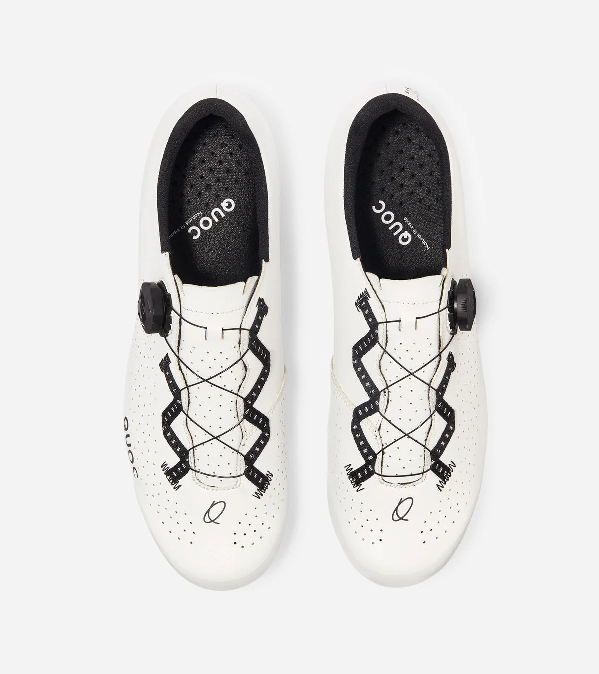 Top view of white QUOC Escape Road Shoes with breathable perforations and zigzag lace pattern for snug fit and airflow.