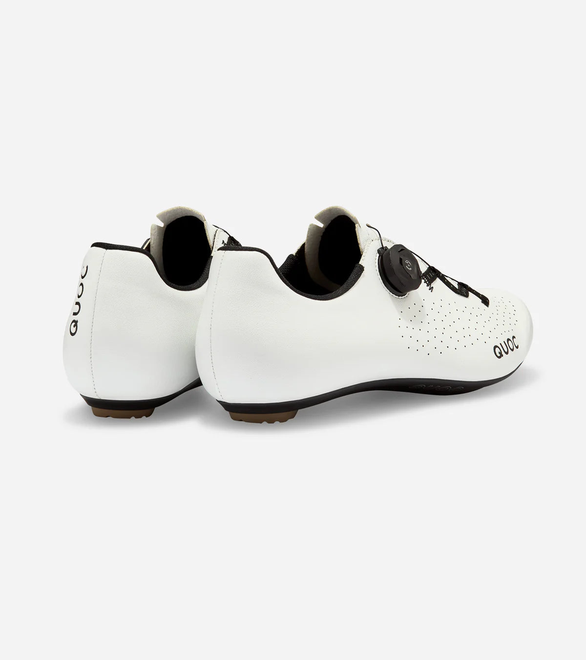 Rear view of white QUOC Escape Road Shoes with reflective branding and supportive heel cup for enhanced cycling performance.