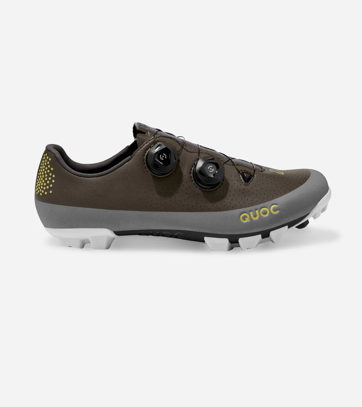Side view of QUOC Gran Tourer XC Off-Road Shoe in brown and grey with yellow branding, built for rugged terrain and cycling performance.