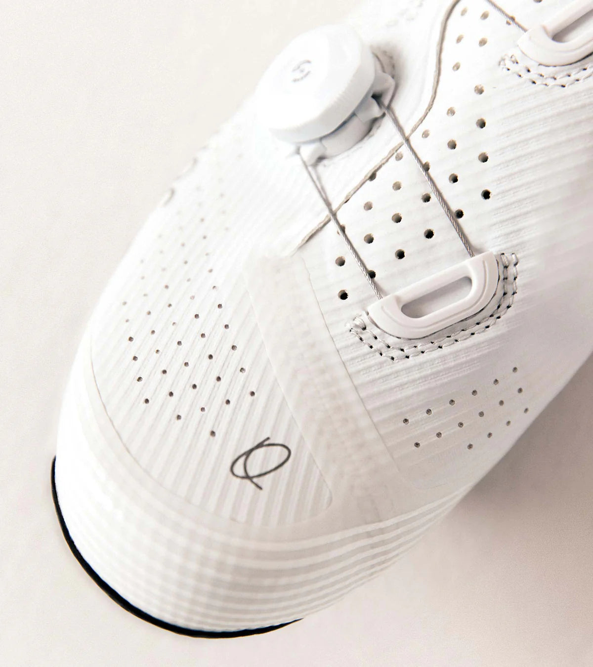 Close-up of QUOC M3 Pro Road Shoe toe box showing micro-perforations and dial system for precise fit and ventilation.