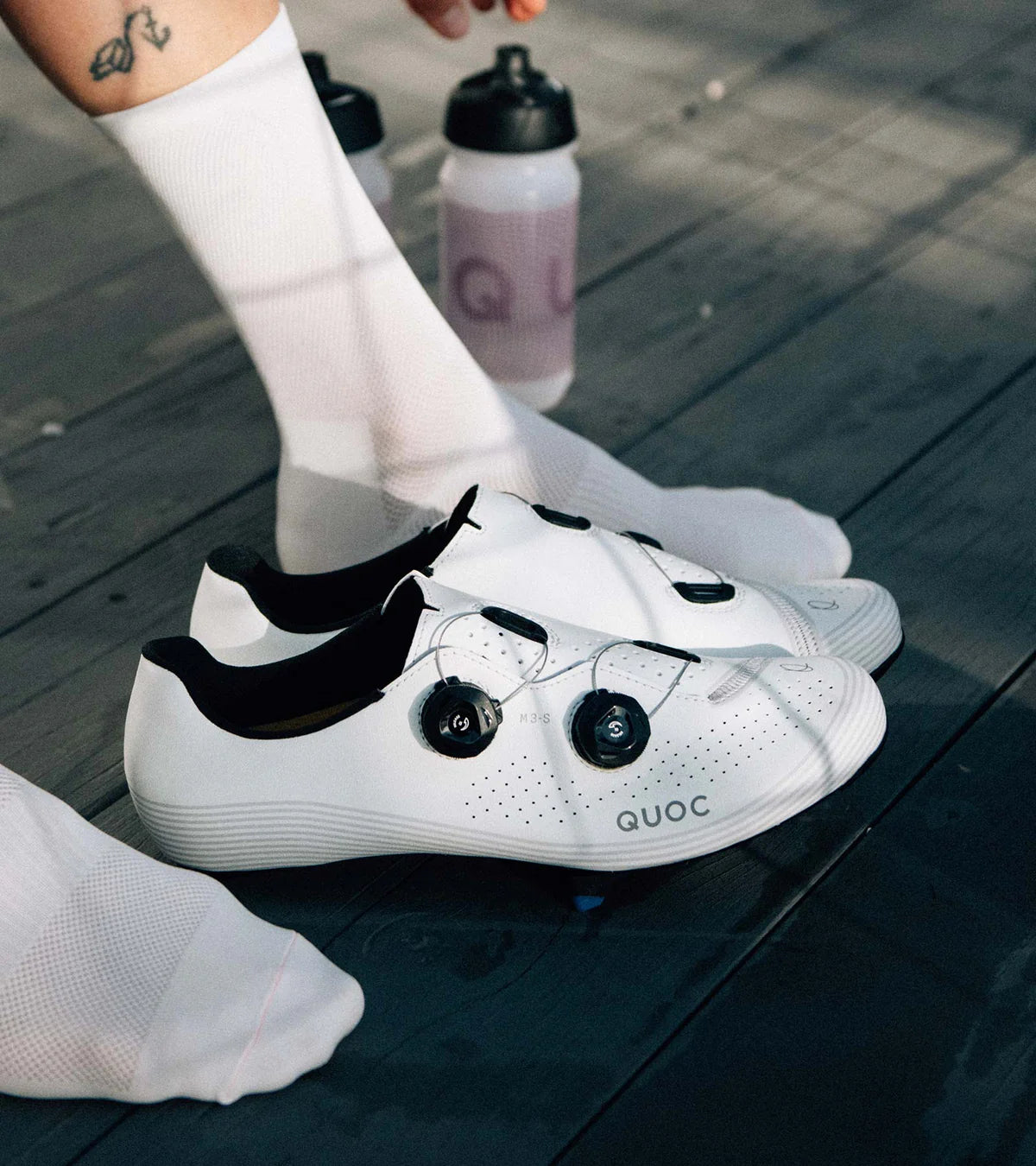 QUOC M3 Sport Road Shoes worn post-ride, showcasing stylish white design and performance-focused construction.