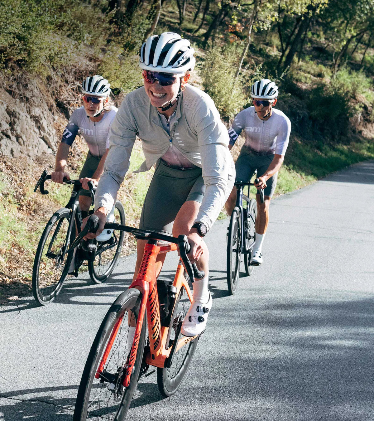 Cyclist riding uphill in QUOC M3 Sport Road Shoes, demonstrating performance and comfort in real-world road cycling.