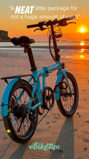 estarli E20.7 Comfort Hybrid E-Bike on beach at sunset, praised by ebiketips for being a neat and affordable electric bike option.
