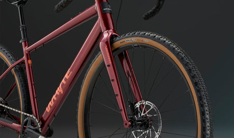 Front fork and tire detail of the Whyte Verro Gravel Bike, featuring disc brakes and wide tires for enhanced control and grip.