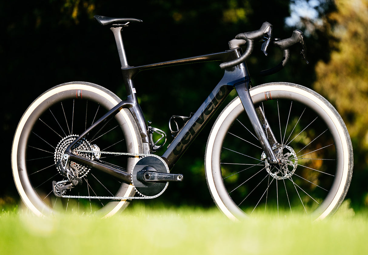Cervelo Aspero-5 SRAM Force AXS 1 Gravel Bike in black displayed on grass, emphasizing race-ready build and SRAM Force AXS drivetrain.