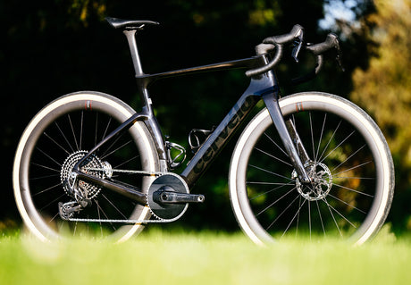 Cervelo Aspero-5 SRAM Force AXS 1 Gravel Bike in black displayed on grass, emphasizing race-ready build and SRAM Force AXS drivetrain.