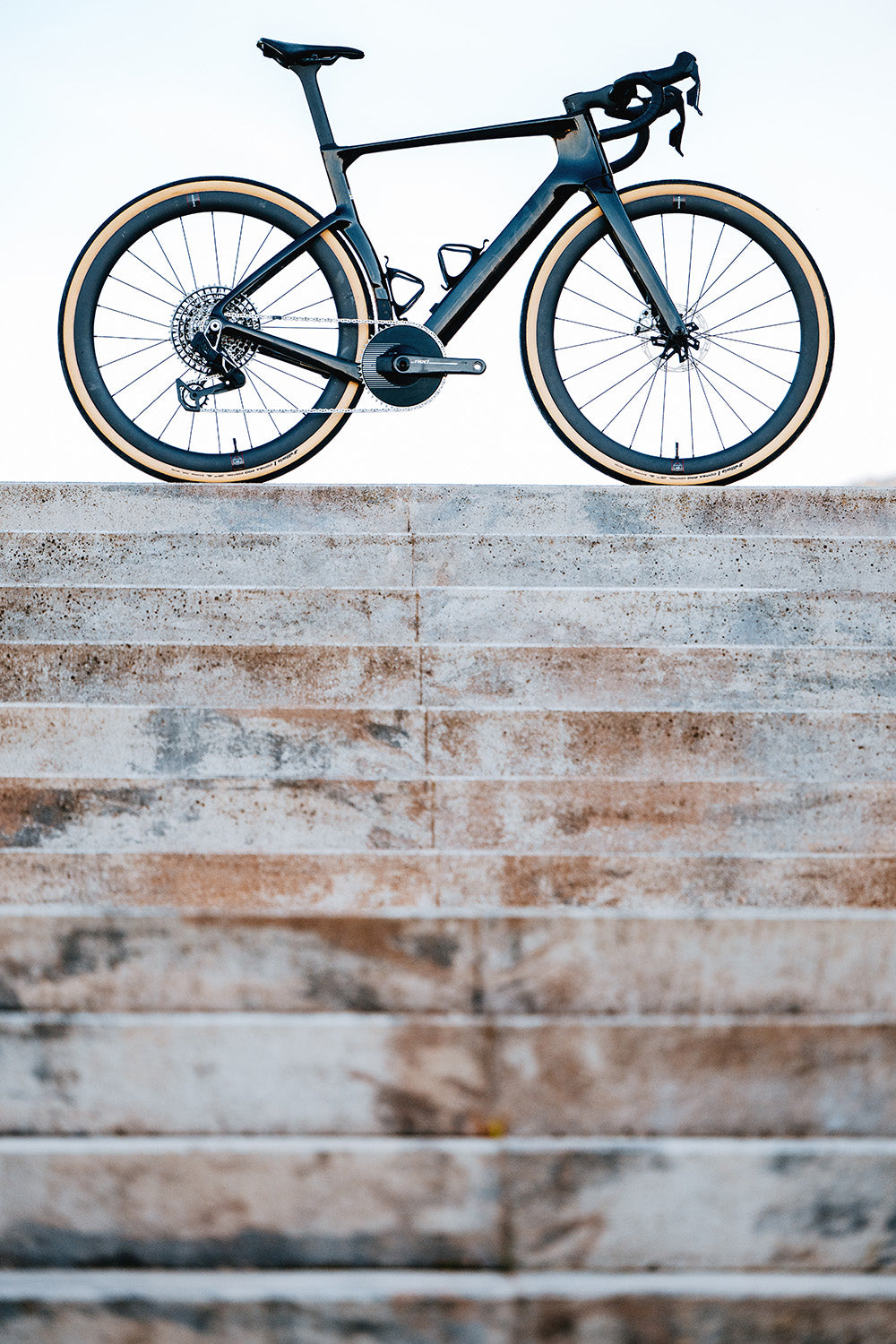 Cervelo Aspero-5 SRAM Force AXS 1 Gravel Bike on stone steps, highlighting its lightweight frame and aggressive geometry.