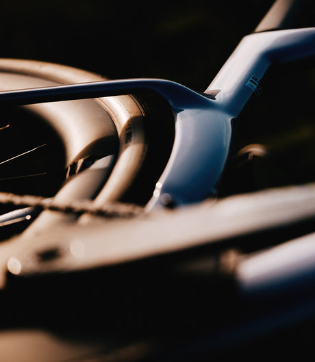 Artistic detail of Cervelo Aspero-5 SRAM Force AXS 1 Gravel Bike's rear triangle and wheel, emphasizing frame aerodynamics.
