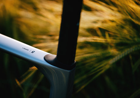 Close-up of Cervelo Aspero-5 SRAM Force AXS 1 Gravel Bike top tube with model branding, highlighting sleek frame finish.