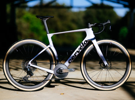 White Cervelo Aspero-5 SRAM Force AXS 1 Gravel Bike in sunlight, showcasing premium build and aerodynamic frame design.