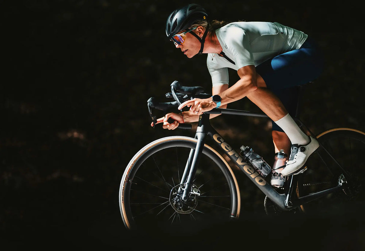 Cyclist on a track bike in a dark setting