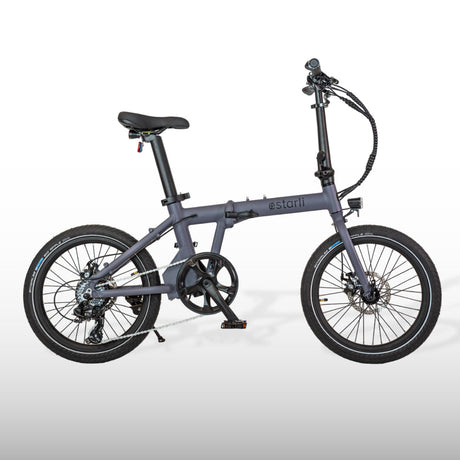 Compact estarli E20.7 Comfort Hybrid E-Bike in matte grey, featuring a lightweight folding frame and disc brakes for city rides.