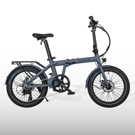 estarli E20.7 Comfort Hybrid E-Bike in grey with rear rack and mudguards, designed for versatile outdoor recreation and commuting.