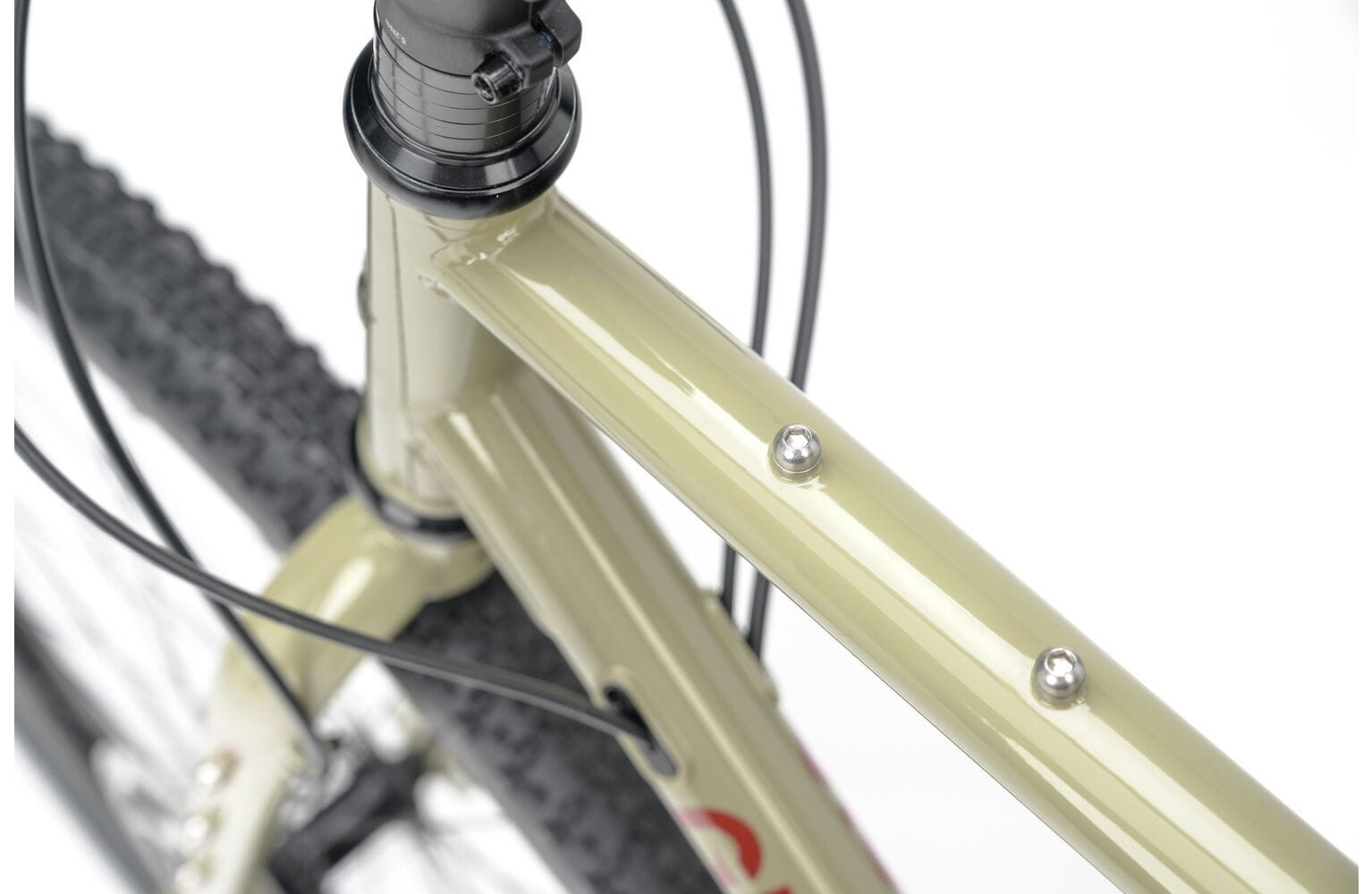 Top tube mounts on the 2025 Genesis Croix De Fer 30 Gravel Bike for attaching bags or accessories during bikepacking adventures.