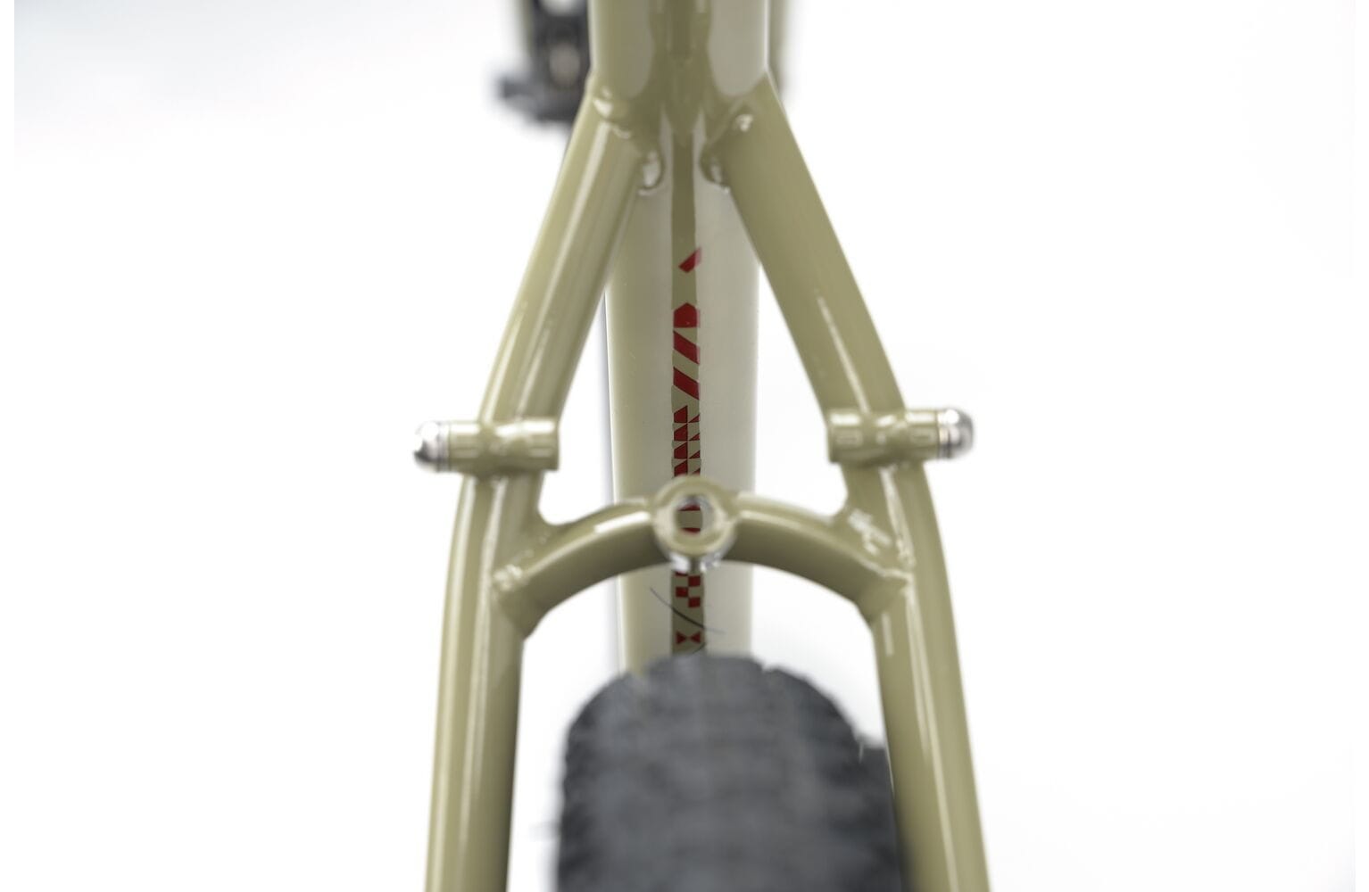 Rear triangle of the 2025 Genesis Croix De Fer 30 Gravel Bike showing tire clearance and mounting points for racks or fenders.