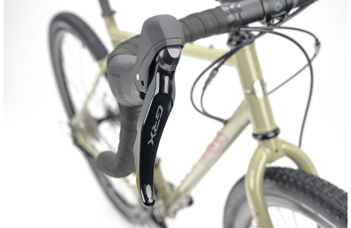 Close-up of Shimano GRX shifter on the 2025 Genesis Croix De Fer 30 Gravel Bike, designed for precise control on mixed terrain rides.