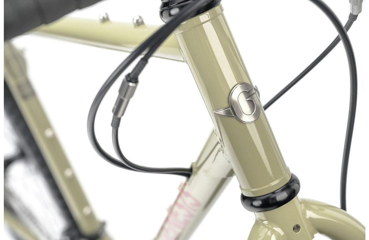 Front head tube of the 2025 Genesis Croix De Fer 30 Gravel Bike with Genesis logo and internal cable routing for a clean finish.