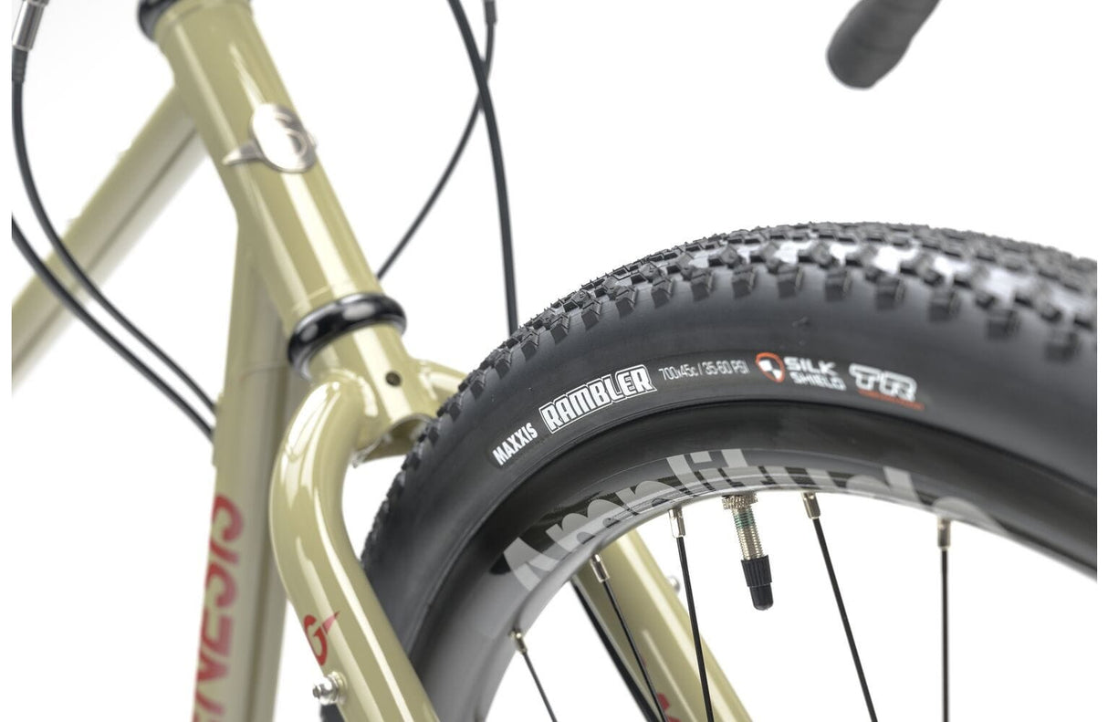 Detail of Maxxis Rambler tire on the 2025 Genesis Croix De Fer 30 Gravel Bike, built for grip and performance on gravel surfaces.