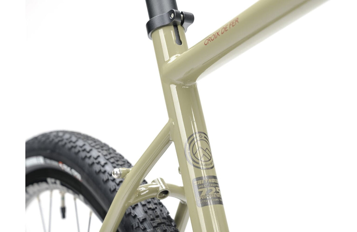 Seat tube of the 2025 Genesis Croix De Fer 30 Gravel Bike showing Croix De Fer branding and Reynolds 725 steel tubing badge.