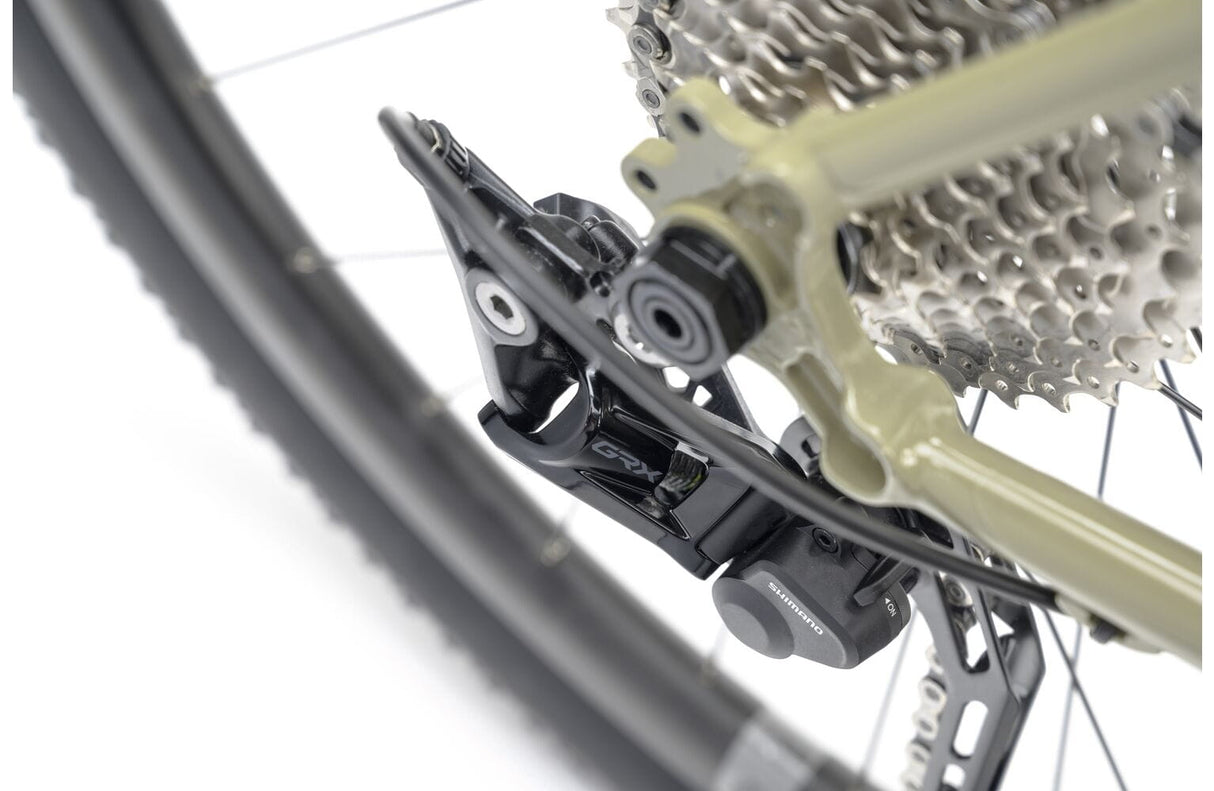 Rear derailleur and cassette of the 2025 Genesis Croix De Fer 30 Gravel Bike featuring Shimano GRX components for reliable shifting.
