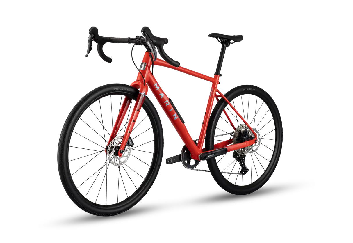 A red and black marin road bicycle with drop handlebars, disc brakes, and a rear derailleur, shown on a clean white background.