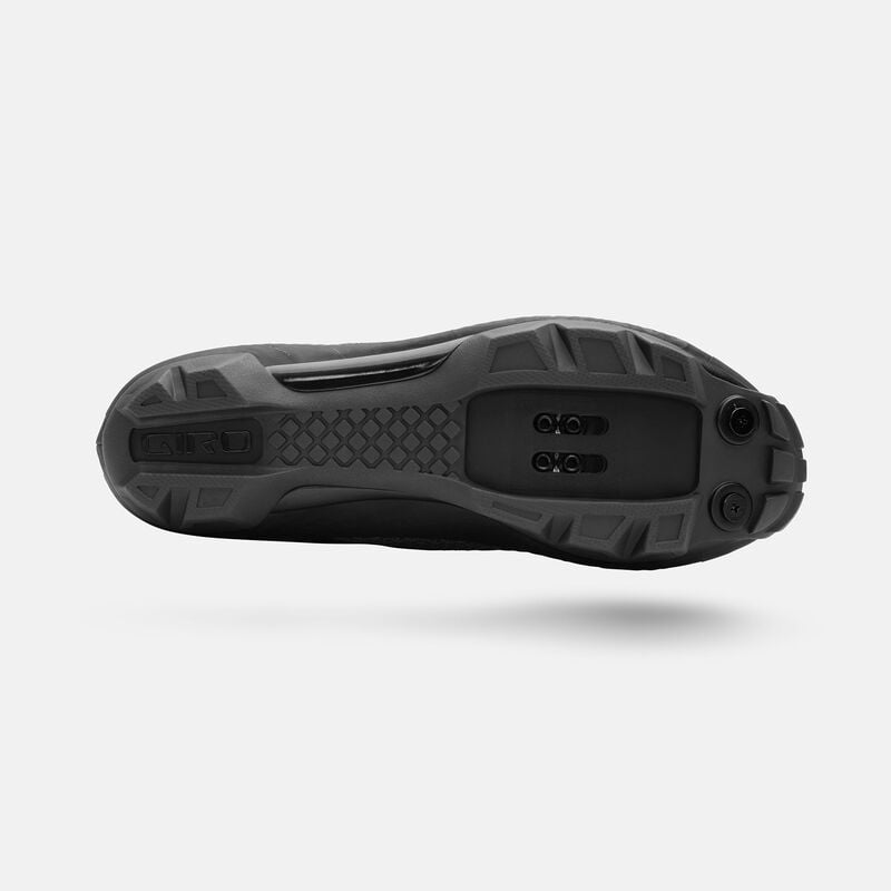 Outsole view of black Giro Ranger MTB Cycling Shoe featuring aggressive tread and 2-bolt cleat compatibility for off-road cycling grip.