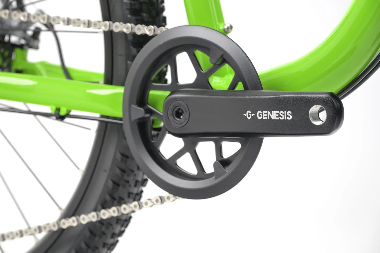 Close-up of black crankset and chainring on bright green Genesis CDA JNR kids gravel bike.