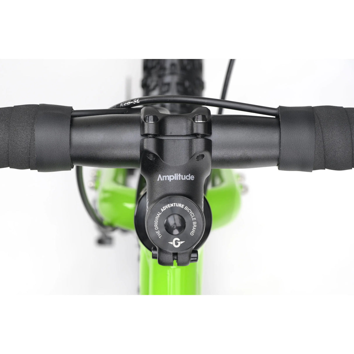 Close-up of black handlebar with integrated black stem and green bike frame underneath.