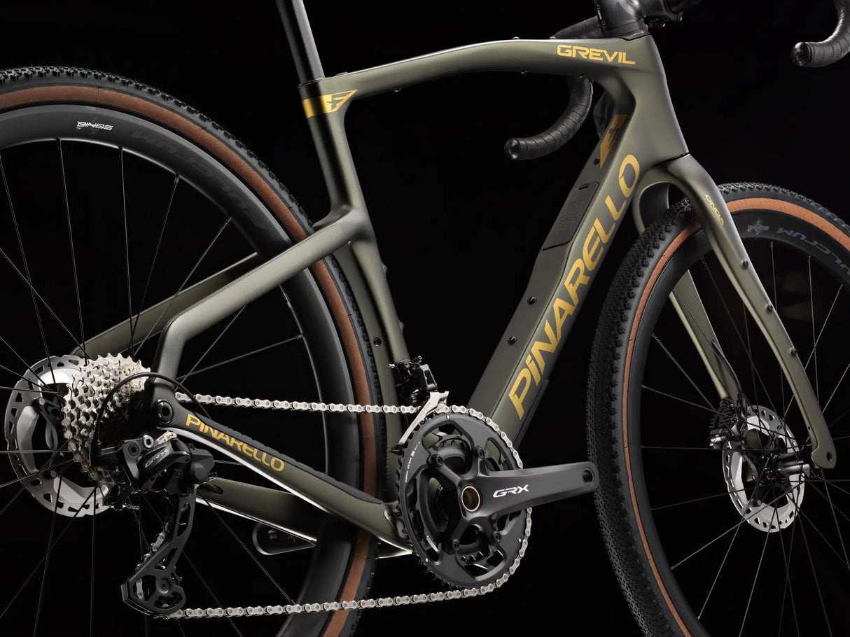 Close-up of a bicycle with 'Pinarello' branding on a black background