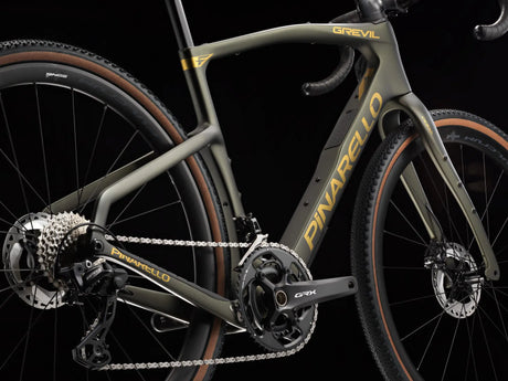 Close-up of a bicycle with 'Pinarello' branding on a black background