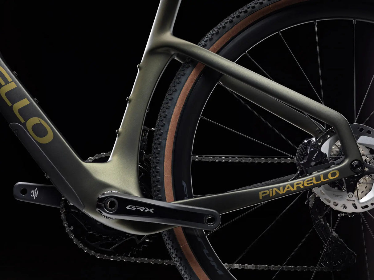 Close-up of a Pinarello bicycle with 'GRX' component on a black background