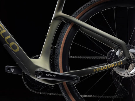 Close-up of a Pinarello bicycle with 'GRX' component on a black background