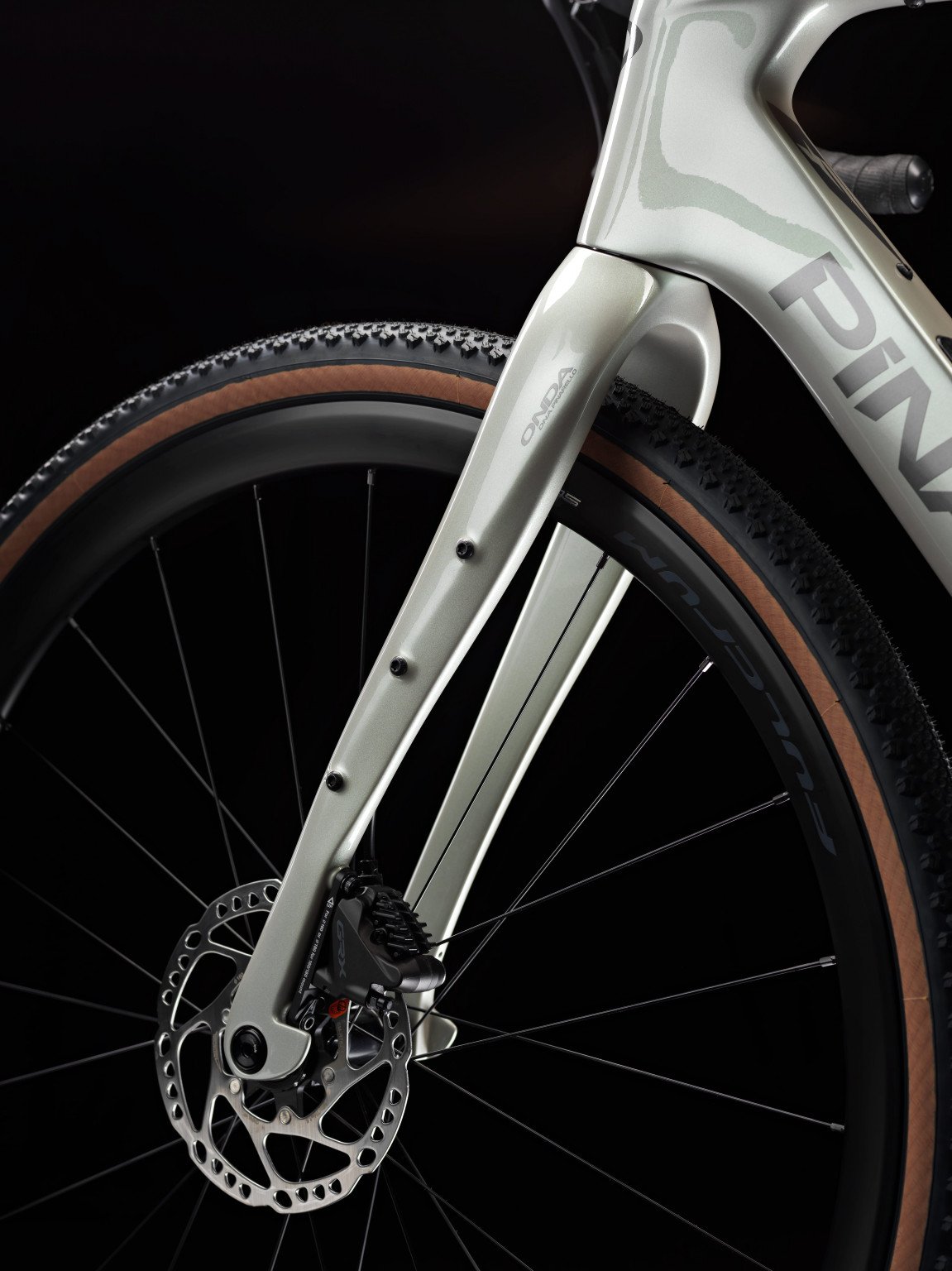 Close-up of a bicycle wheel with a dark background